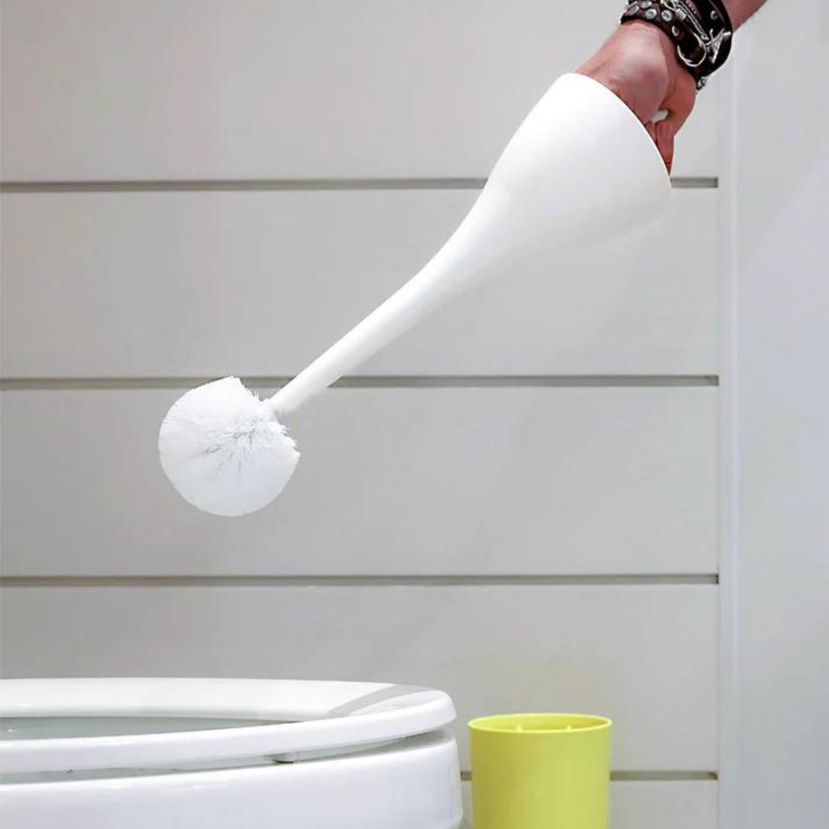Excalibur toilet brush in grey held in hand for scale